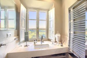 a bathroom with a sink and a window at La Loggia in Castelfalfi +17 photos