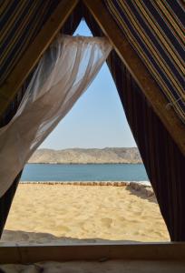a tent with a view of the beach at Heissa Hostel in Aswan