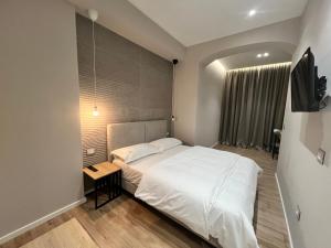 Postel nebo postele na pokoji v ubytování Enzo rooms & apartment Blloku