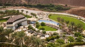 an aerial view of a resort with a pool at JW Marriott Hotel Muscat in Muscat