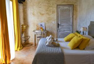 a white teddy bear sitting on a bed in a room at Fiore di Machja in Coti-Chiavari