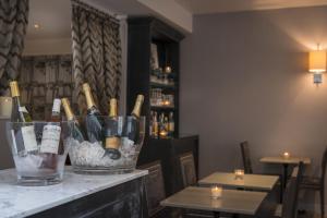 a bar with a bunch of bottles of wine at Acacias Etoile in Paris +17 photos