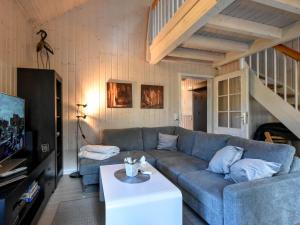 a living room with a couch and a table at Ferienhaus Ostseeblick 236 in Baabe