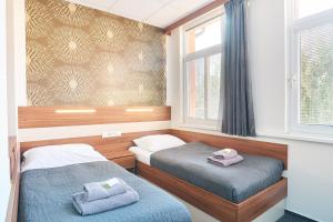Postel nebo postele na pokoji v ubytování Wellness Hotel Kocanda