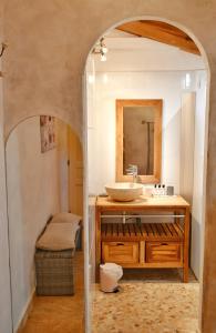 a bathroom with a sink and a mirror at Fiore di Machja in Coti-Chiavari