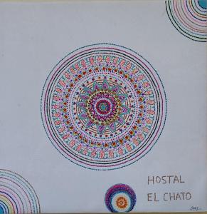 a box with a drawing of a mandala on it at Hostal Hotel EL Chato in El Barraco