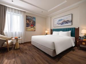 Voodi või voodid majutusasutuse L'Signature Hotel & Spa toas