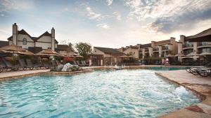 a swimming pool with a fountain in a resort at Eden Resort and Suites, BW Premier Collection in Lancaster