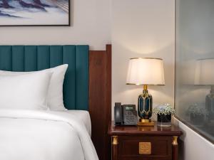Voodi või voodid majutusasutuse L'Signature Hotel & Spa toas