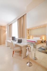 TV a/nebo společenská místnost v ubytování Horizont Hotel