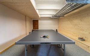 a ping pong table in the middle of a room at Hotel Ondras z Beskyd in Ostravice