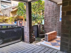 a brick building with a bench in a courtyard at Bito Homestay 
