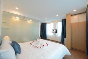 Postel nebo postele na pokoji v ubytování Hanoi Prime Garden Hotel & Spa