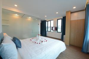 Postel nebo postele na pokoji v ubytování Hanoi Prime Garden Hotel & Spa