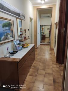 a large kitchen with a counter and a hallway at Da Francesca in Scardovari