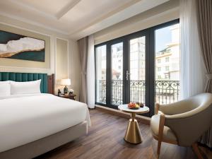 Voodi või voodid majutusasutuse L'Signature Hotel & Spa toas