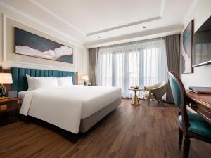 Voodi või voodid majutusasutuse L'Signature Hotel & Spa toas