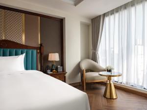 Voodi või voodid majutusasutuse L'Signature Hotel & Spa toas