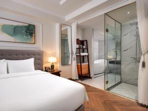 Voodi või voodid majutusasutuse L'Signature Hotel & Spa toas