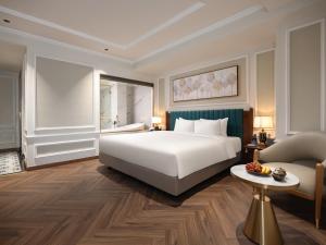 Voodi või voodid majutusasutuse L'Signature Hotel & Spa toas