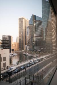 a view of a city with cars parked on a street at Classy 1BR in Al Sahab Dubai Marina in Dubai