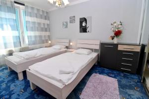 Posteľ alebo postele v izbe v ubytovaní Cozy Apartment FREE parking