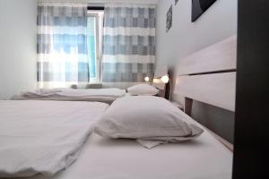 Posteľ alebo postele v izbe v ubytovaní Cozy Apartment FREE parking