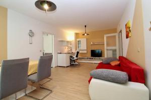 Televízia a/alebo spoločenská miestnosť v ubytovaní Cozy Apartment FREE parking
