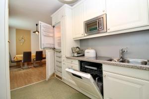 Kuchyňa alebo kuchynka v ubytovaní Cozy Apartment FREE parking
