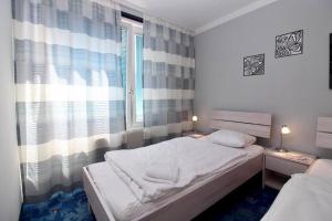 Posteľ alebo postele v izbe v ubytovaní Cozy Apartment FREE parking