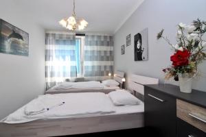 Posteľ alebo postele v izbe v ubytovaní Cozy Apartment FREE parking