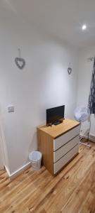 a room with a desk with a computer on it at Beautiful Rooms with free on street parking in Sydenham in Forest Hill
