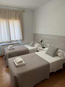Postel nebo postele na pokoji v ubytování Apartaments IXA