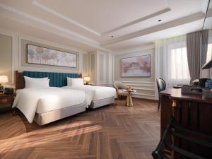 Voodi või voodid majutusasutuse L'Signature Hotel & Spa toas