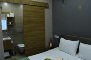 a hotel room with a bed and a bathroom at Cibali Hotel Istanbul in Istanbul