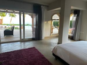 Postel nebo postele na pokoji v ubytování Casa Del Sol