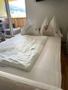 Ένα ή περισσότερα κρεβάτια σε δωμάτιο στο Ferienwohnung Familie Alt Rinn, Innsbruck +50 φωτογραφίες