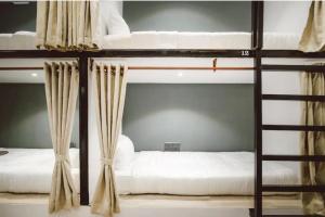 Postel nebo postele na pokoji v ubytování DANG HOSTEL + 3 fotografie