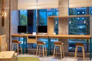 TV a/nebo společenská místnost v ubytování Home2 Suites by Hilton Guiyang Guanshanhu