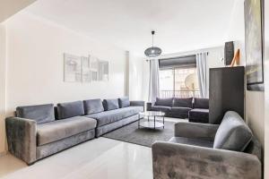 a living room with a couch and a table at Hassan executive appartment in Rabat