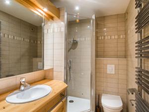 a bathroom with a sink and a shower and a toilet at Appartement Méribel, 4 pièces, 6 personnes - FR-1-565-47 in Les Allues