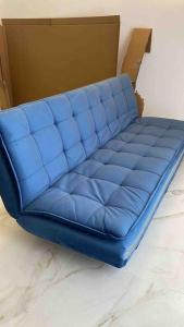 a blue couch sitting inside of a box at Exclusivo y único apartamento in Valencia