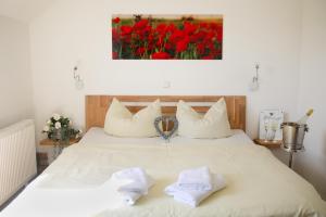 Postel nebo postele na pokoji v ubytování Hotel Duwakschopp