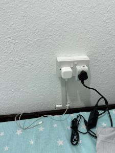 a white outlet with stars on a wall at oNLY MALE GENDER ROYAL LUXURY PARTITION SMALL ROOM in Abu Dhabi