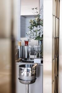 a kitchen with a counter with glasses and a stove at Limassol Del Mar in Limassol