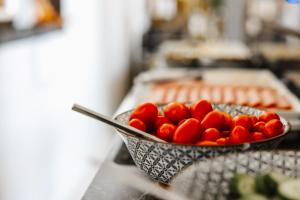 a bowl of tomatoes sitting on top of a counter at Limassol Del Mar in Limassol