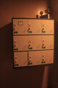 a cabinet with four drawers on a wall at Laguno Bed And Breakfast Hostel in Moalboal