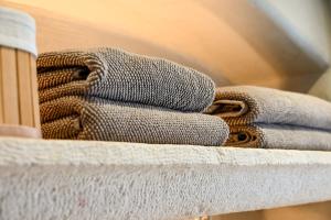 a pile of towels sitting on top of a table at 7oaks Noble House in Dubrovnik