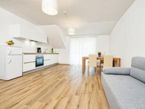 a living room with a couch and a table at Apartment Elisabeth by Interhome in Egg am Faaker See
