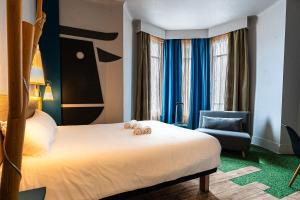 Postel nebo postele na pokoji v ubytování ibis Styles Moulins Centre + 37 fotografií